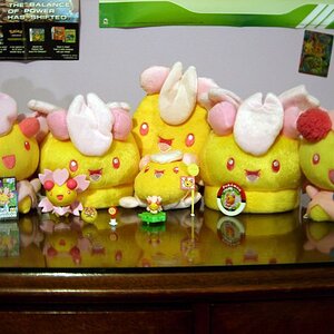 Agh, awful lighting. D: But this is my Cherrim collection in full. (Well, minus a sticker.)