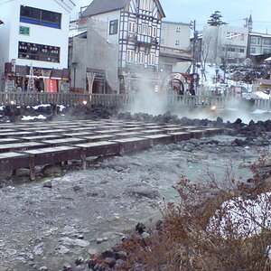 A photo depicting general scenery of a small town which economy depends on tourists and the hot spring industry.