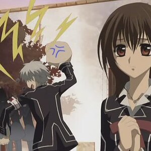 Yuki (the brown haired girl in care you don't know vampire knight) looks all serioius whiel Zero (dude in the backround) his expresion is so priceless