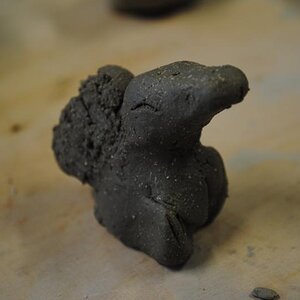 Clay sculpture of Cyndaquil (un-fired and un-painted).