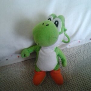 A snapshot of my Yoshi keychain plush =D <3!!