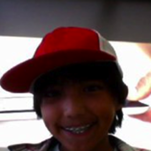 This is me playing in a  store with an iPad my mom got :)
oh and btw i dont wear that hat anymore and i dont hav anymore braces :)
