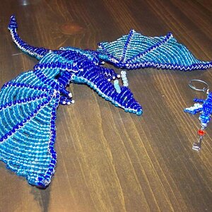 Large Blue Dragon with its Keychain partner.
I made these for a friend for Valentine's Day :)
It was also my first large 3D project.