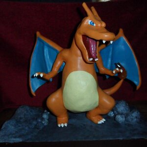 12" Charizard statue on wooden base