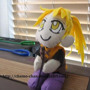 This is a plushie of Yellow.
She's fishing on my fish tank.
(LOL.)
See that link on the pic?
*coughGotherecough*